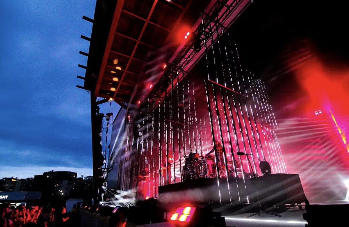 Outdoor concert stage with red lighting
